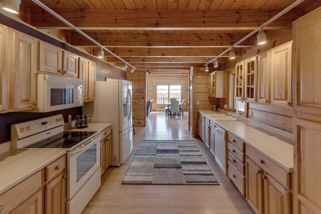 11375 Grouse Loop NW, Walker, MN 56484 - kitchen with white appliances, wood ceiling with exposed beams, light wood-type flooring, a sink, and wooden walls