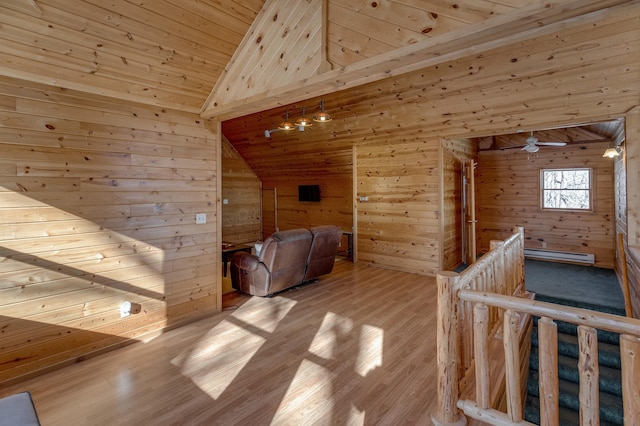 11375 Grouse Loop NW, Walker, MN 56484 - hall with lofted ceiling, wooden ceiling, wood walls, wood finished floors, and an upstairs landing