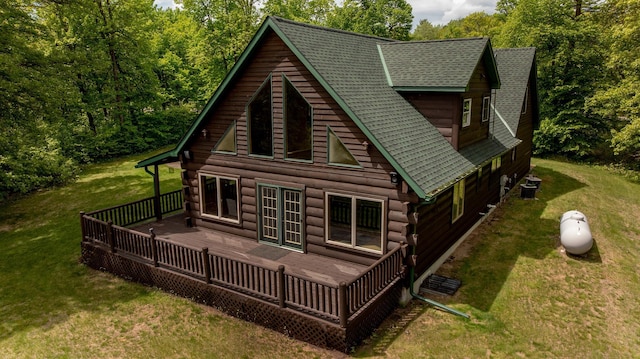 11375 Grouse Loop NW, Walker, MN 56484 - rear view of property featuring a wooden deck, log siding, a lawn, and a shingled roof