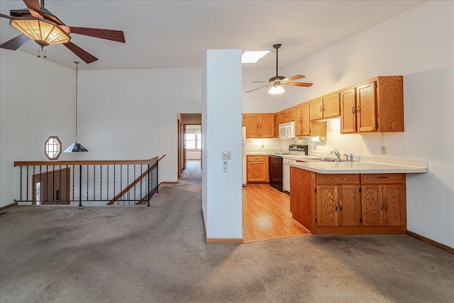 kitchen featuring light carpet, sink, white appliances, and high vaulted ceiling