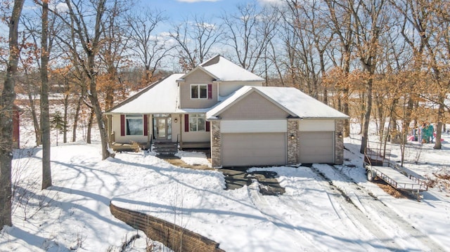 view of front of property with stone siding and an attached garage