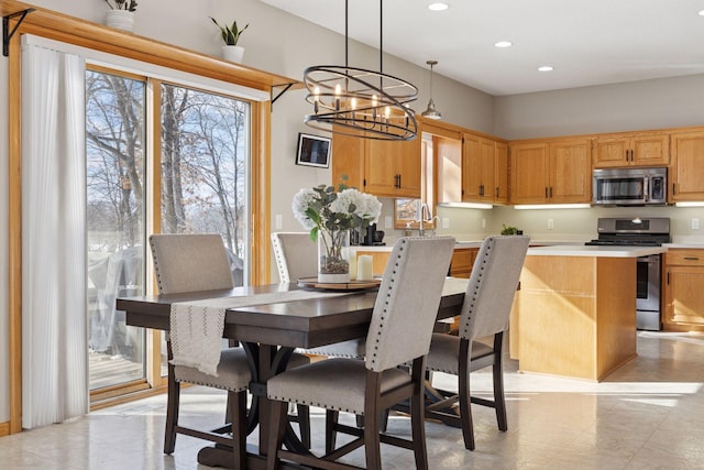 dining room featuring an inviting chandelier and recessed lighting