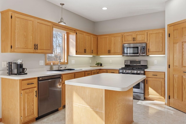 kitchen featuring a center island, light countertops, recessed lighting, appliances with stainless steel finishes, and a sink