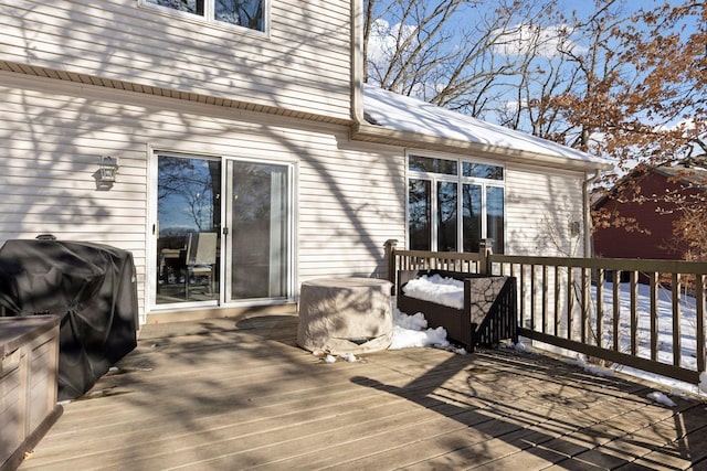 wooden terrace with area for grilling