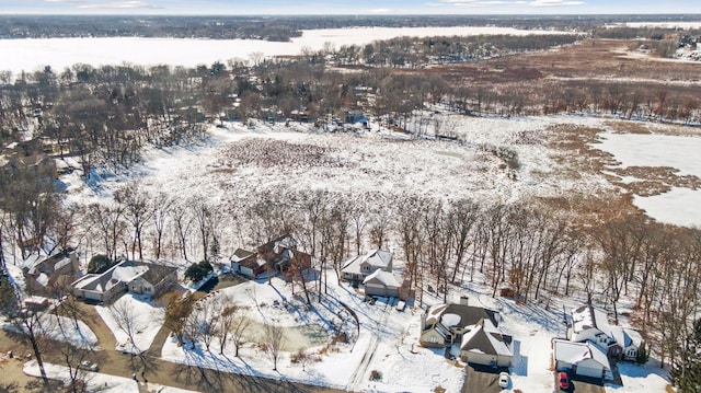 snowy aerial view featuring a residential view