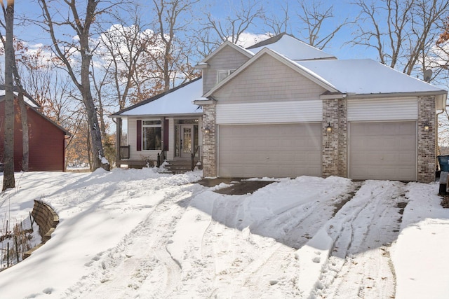 view of front of home featuring a garage and brick siding