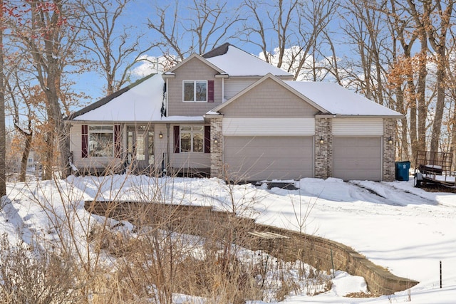 view of front of house with a garage and brick siding