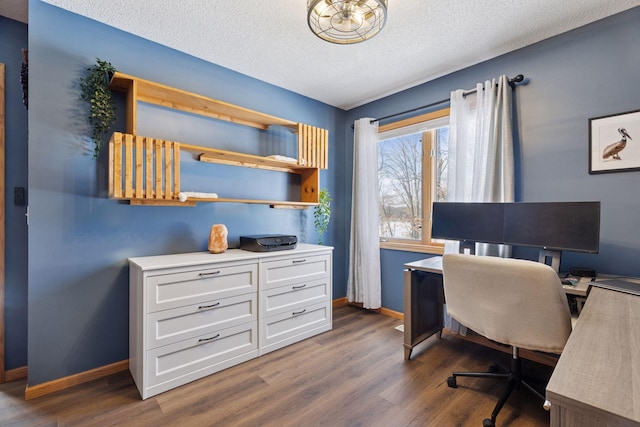 office area featuring baseboards, a textured ceiling, and dark wood-style floors