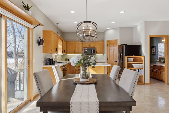 dining space featuring a notable chandelier, recessed lighting, and baseboards