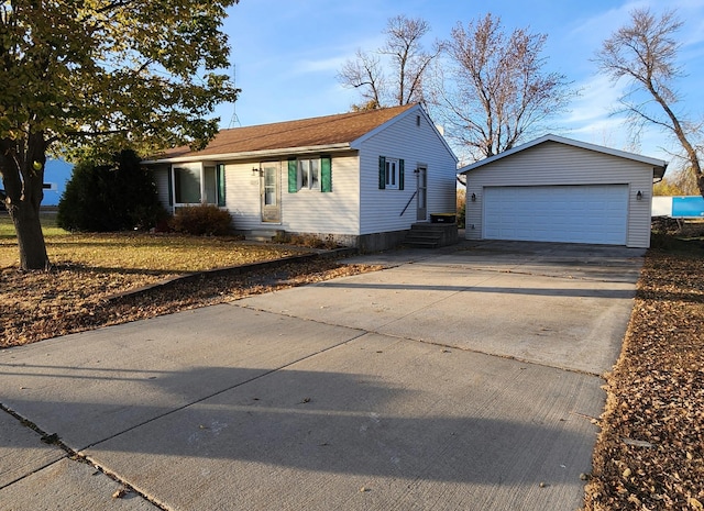 view of front of house with a garage and an outdoor structure