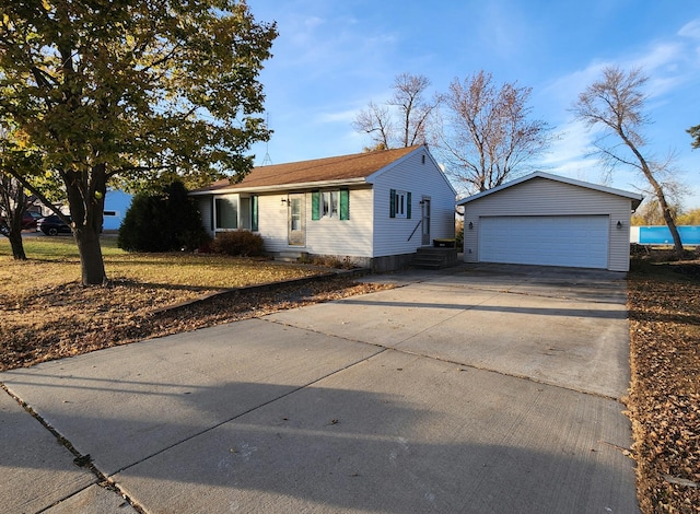 view of front of property with an outbuilding and a detached garage