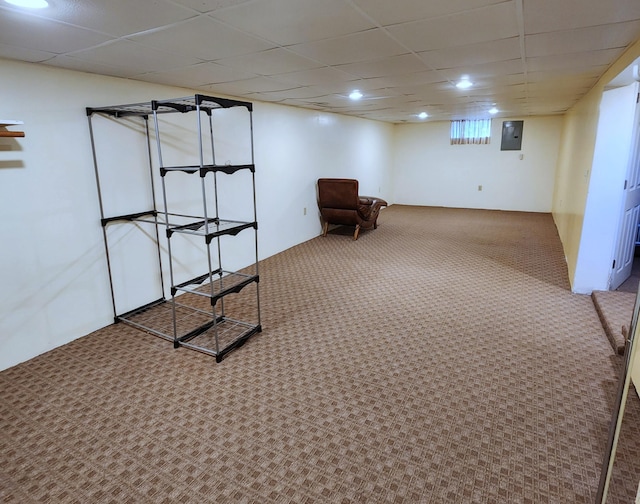 sitting room with carpet and a drop ceiling