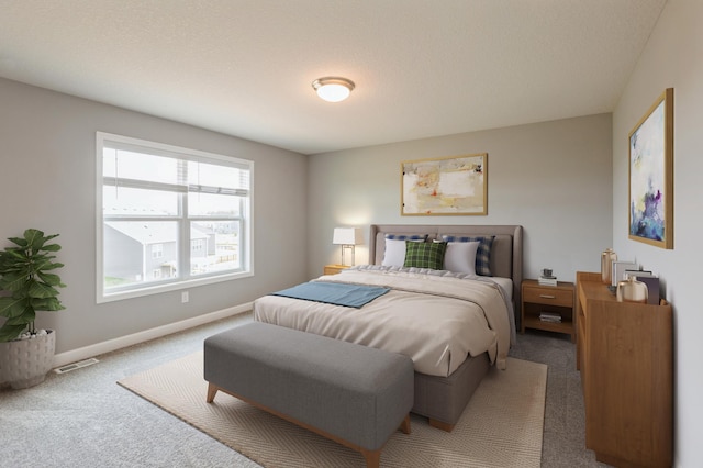 carpeted bedroom with a textured ceiling