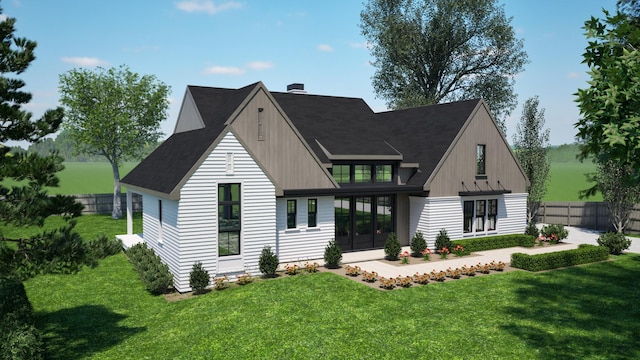 back of property with french doors, a chimney, fence, and a lawn