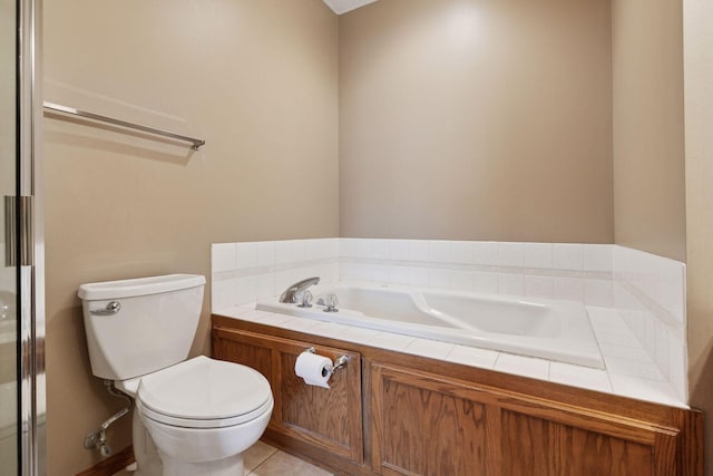 full bathroom featuring a bath, tile patterned flooring, and toilet