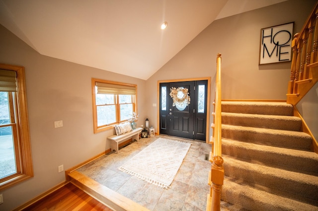 foyer featuring lofted ceiling