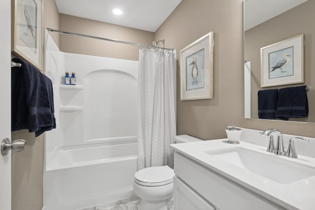 full bathroom featuring vanity, shower / tub combo, and toilet