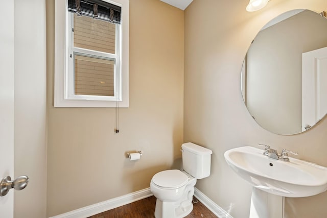 5270 Jewel Ln N, Plymouth, MN 55446 - half bathroom featuring toilet, wood finished floors, and baseboards