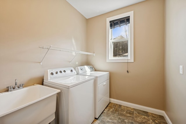5270 Jewel Ln N, Plymouth, MN 55446 - washroom with baseboards and washer and dryer