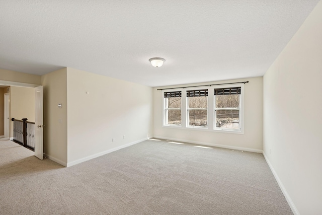 5270 Jewel Ln N, Plymouth, MN 55446 - unfurnished room featuring carpet floors, a textured ceiling, and baseboards