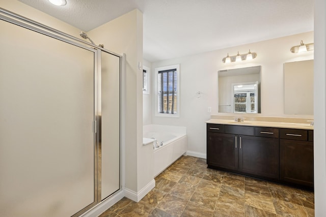 5270 Jewel Ln N, Plymouth, MN 55446 - bathroom with a shower stall, plenty of natural light, vanity, and a textured ceiling