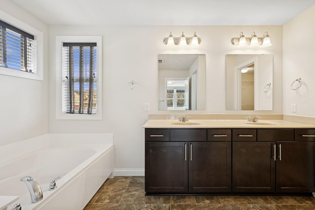 5270 Jewel Ln N, Plymouth, MN 55446 - full bath featuring double vanity, a garden tub, and baseboards