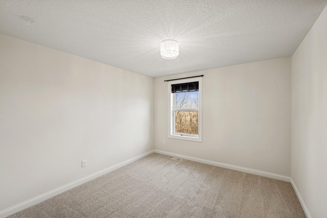 5270 Jewel Ln N, Plymouth, MN 55446 - unfurnished room with light carpet, baseboards, and a textured ceiling