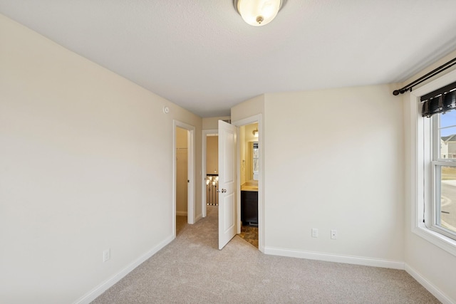 5270 Jewel Ln N, Plymouth, MN 55446 - unfurnished bedroom featuring light colored carpet, baseboards, and ensuite bath