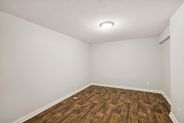 5270 Jewel Ln N, Plymouth, MN 55446 - empty room with dark wood-type flooring, baseboards, and a textured ceiling