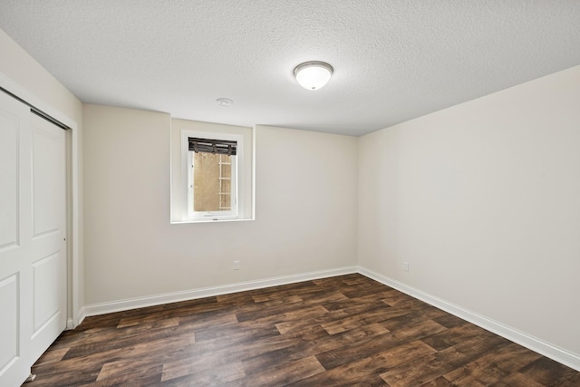 5270 Jewel Ln N, Plymouth, MN 55446 - spare room featuring dark wood-style floors, a textured ceiling, and baseboards