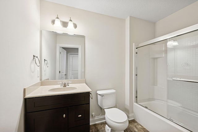 5270 Jewel Ln N, Plymouth, MN 55446 - full bath featuring toilet, vanity, bath / shower combo with glass door, and baseboards