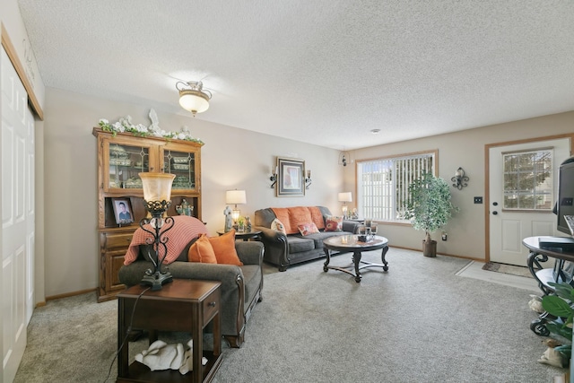 carpeted living room featuring a textured ceiling