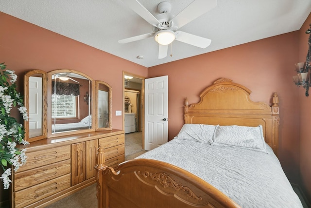 bedroom with dark carpet and washer / dryer