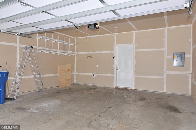 garage featuring a garage door opener and electric panel