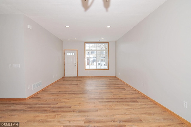 empty room with light wood-type flooring