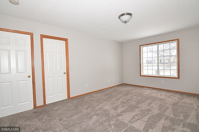 unfurnished bedroom with carpet