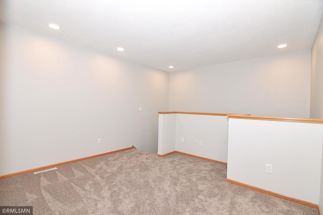 spare room with light colored carpet