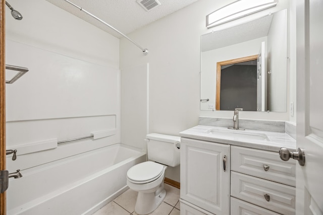 full bathroom featuring  shower combination, tile patterned flooring, vanity, a textured ceiling, and toilet