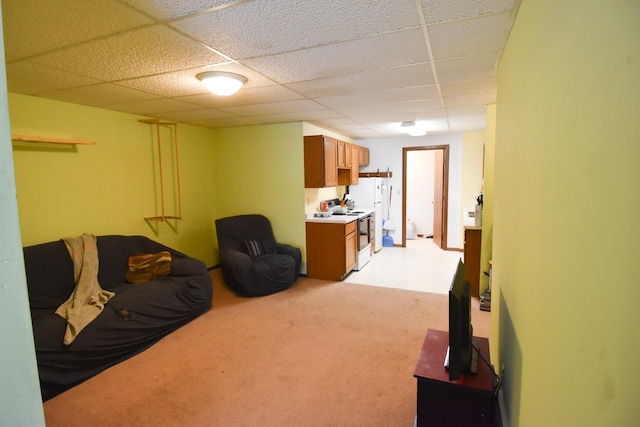 living room with light carpet and a drop ceiling