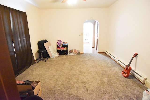 miscellaneous room with baseboard heating, ceiling fan, and carpet floors