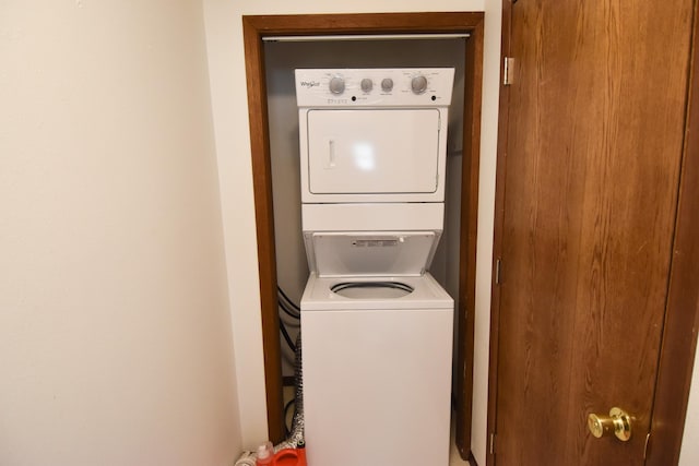 laundry area featuring stacked washer and dryer