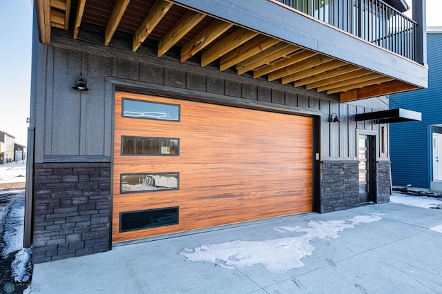 exterior space featuring stone siding and board and batten siding