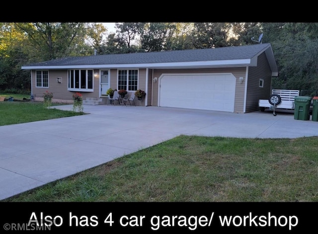 ranch-style home with a garage, driveway, and a front yard