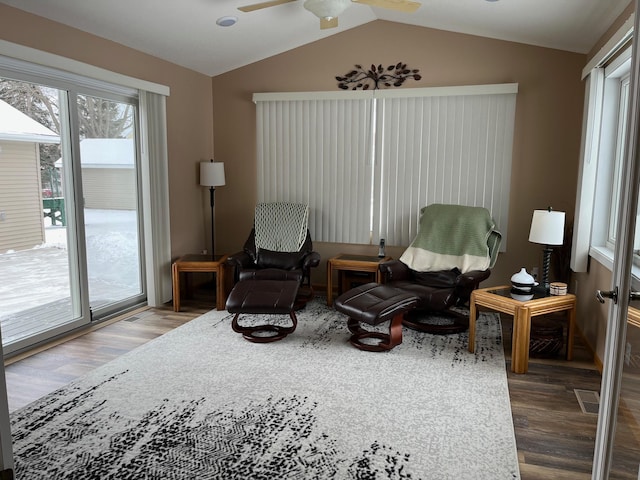 sitting room featuring ceiling fan, lofted ceiling, and wood-type flooring