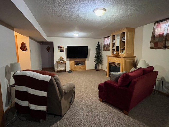 carpeted living room with a textured ceiling