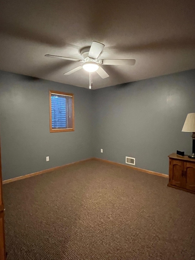 carpeted empty room with ceiling fan