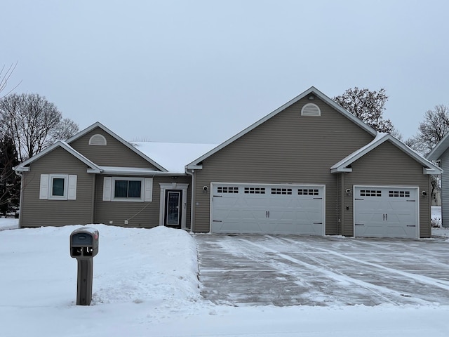 ranch-style house featuring a garage