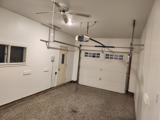 garage featuring a garage door opener and ceiling fan