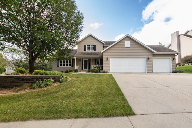 view of front of property with a garage and a front lawn