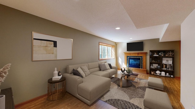 living room with wood-type flooring and a textured ceiling